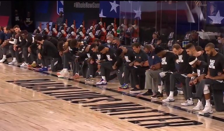 Two Major NBA Teams Kneel While Wearing BLM Shirts During The National Anthem Before First Game Of The NBA Restart Season