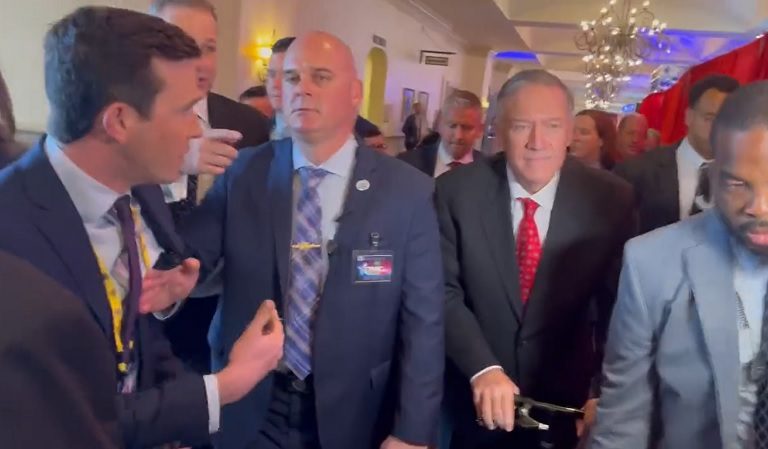 A Man Who Looked To Be Security For Trump-Era Secretary Of State Mike Pompeo Appeared To Physically Shove A Reporter Out Of The Way After He Questioned Pompeo About His Past “Soft Praise” For Putin
