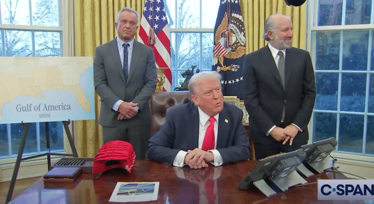 RFK Jr. Has Priceless Reaction As Trump Turns The Oval Office Into A Merch Shop