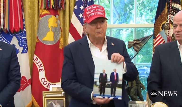 Trump Flaunts Personal Photo Gift From Putin In the Oval Office